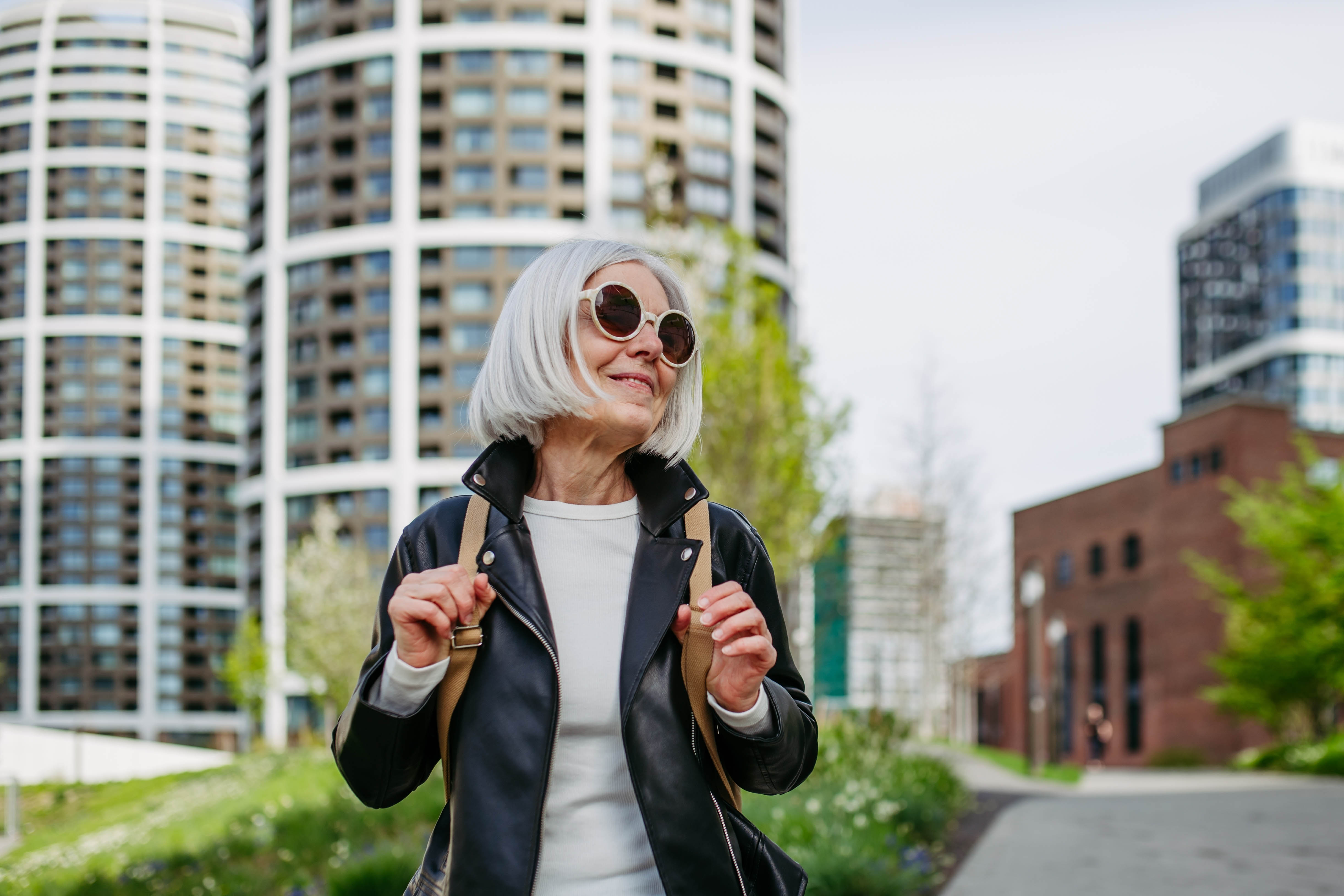 Happy middle aged woman outside, living her best life